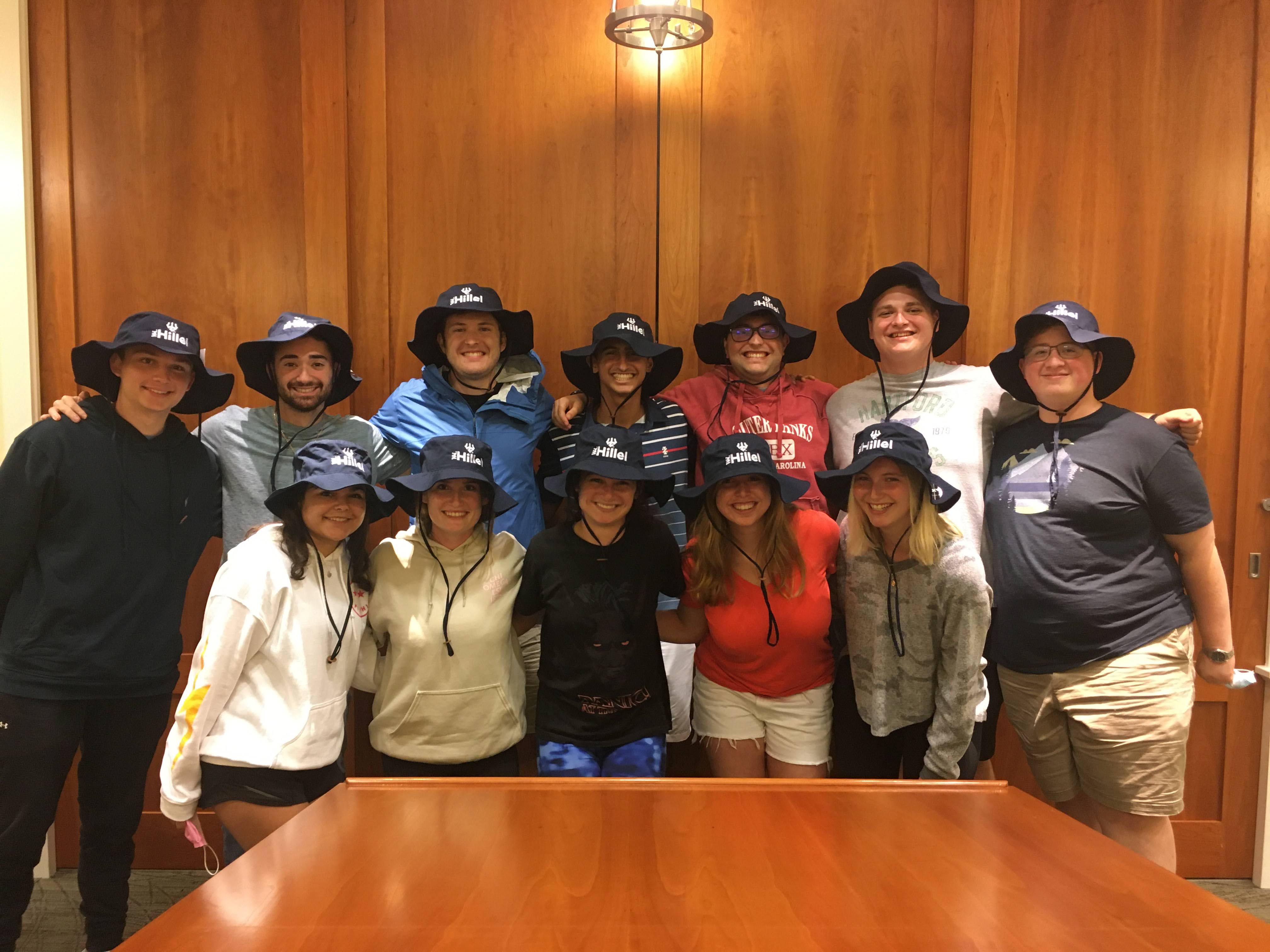Hillel Student Board receives their yearly board gift of bucket hats.